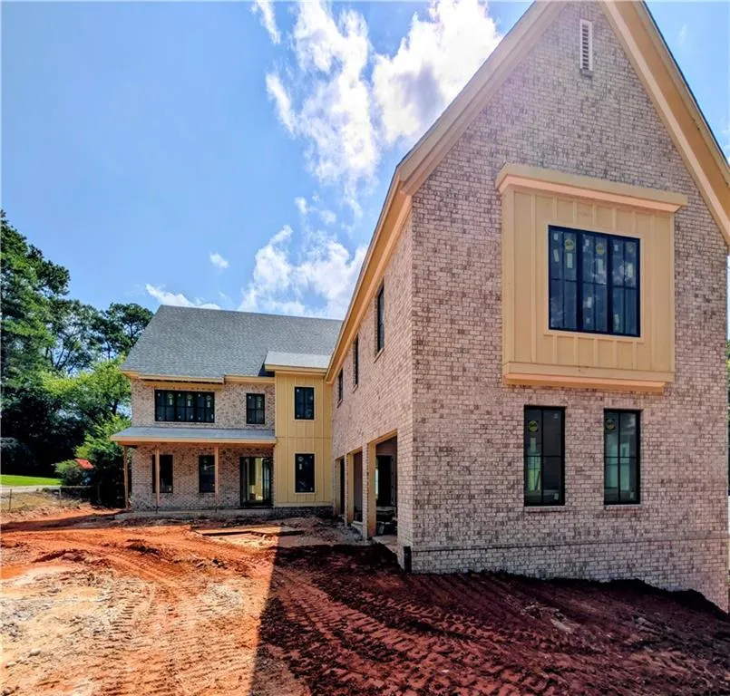 Back of property with brick siding