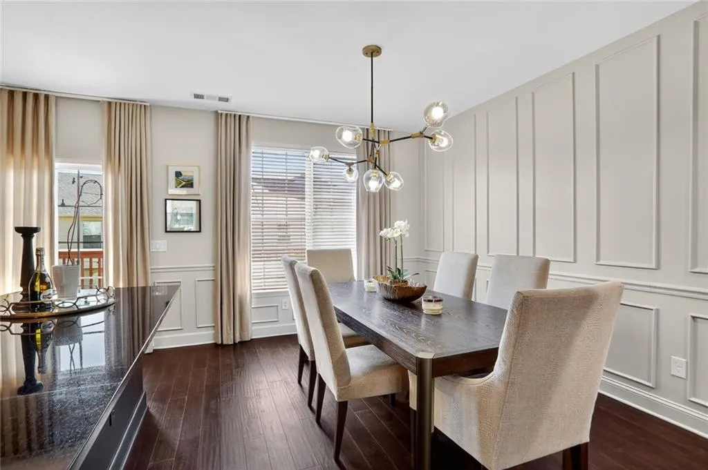 So many lovely updates in this home, from the lighting, custom draperies, wainscoting and that's just in the dining room.