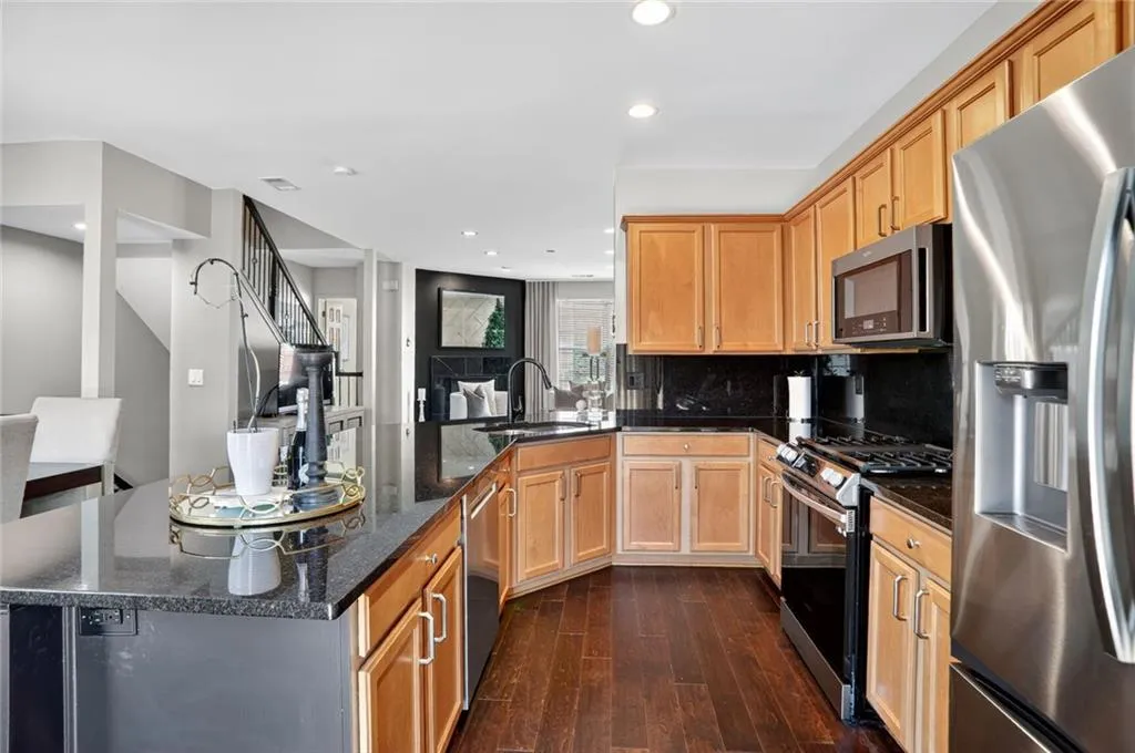 A true chef's kitchen with plenty of countertop for food prep, serving, a gas range - not to mention all the storage.
