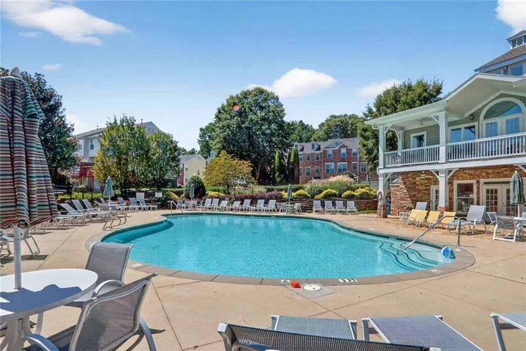 Community pool with a patio and a balcony - you can also enjoy the fitness center.