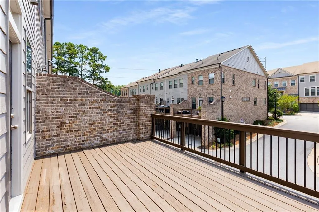 Wooden terrace featuring a residential view