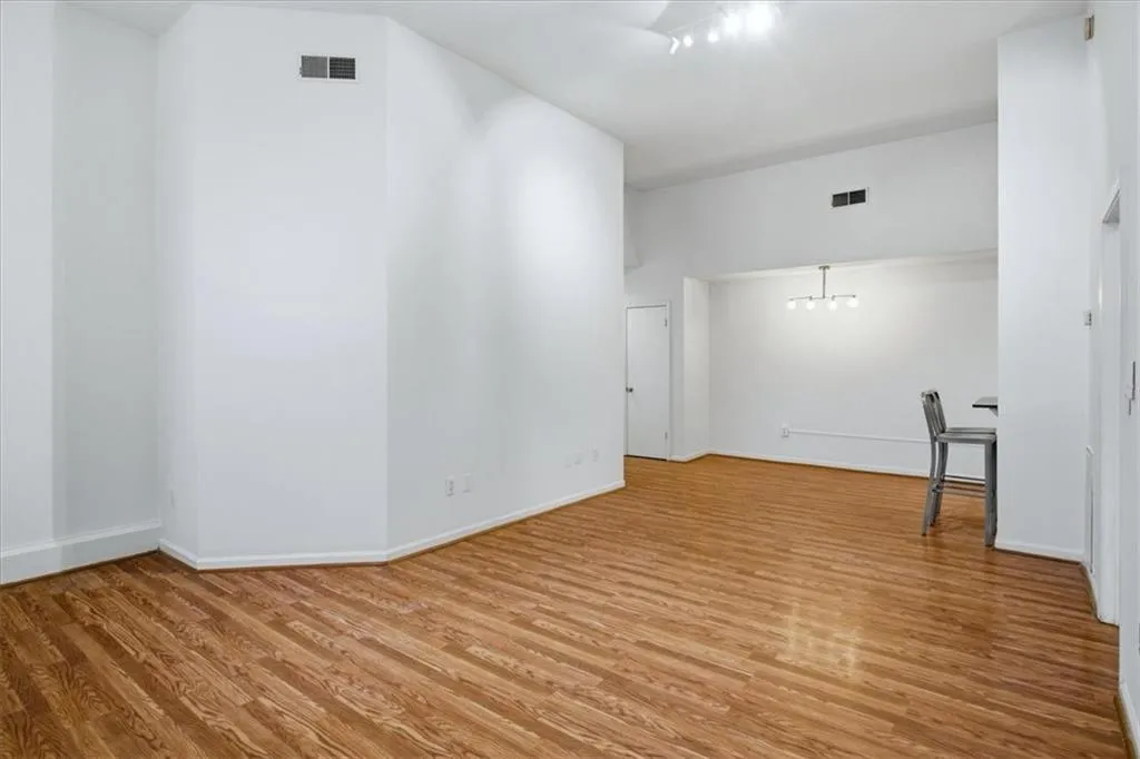 Open Spacious Living Area with Automatic Shades