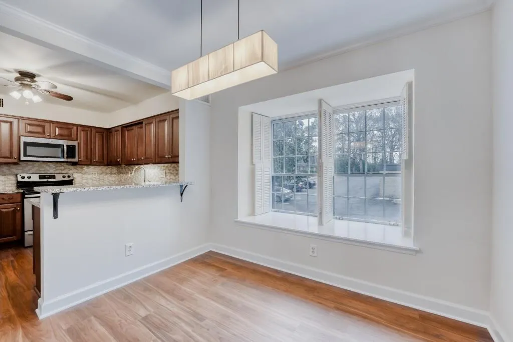 Dining room looking into kitchen with breakfact bar