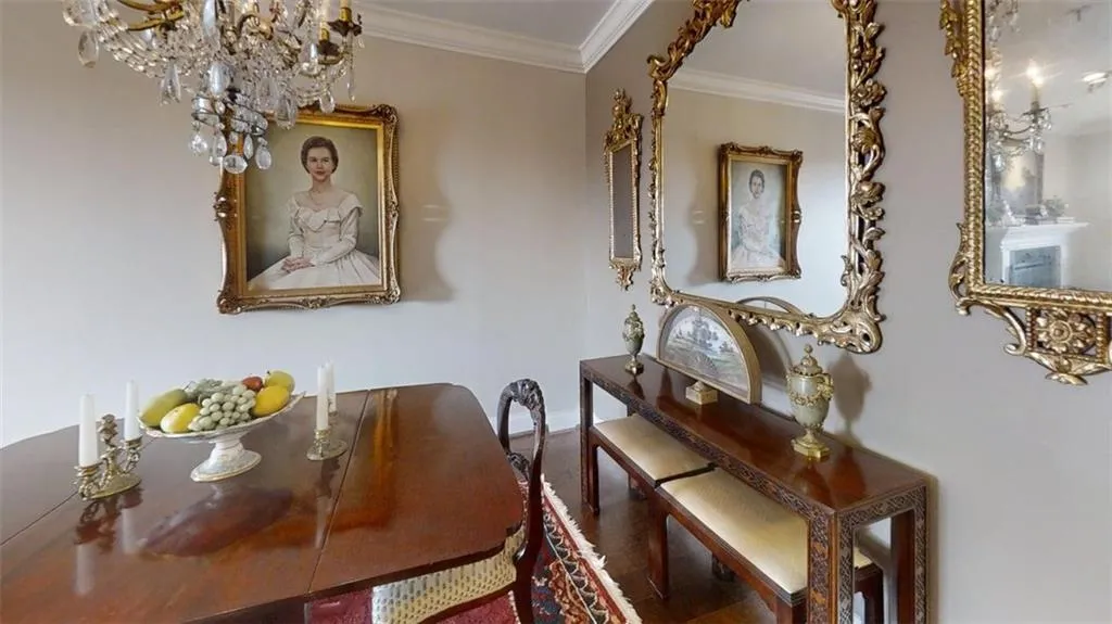 Dining space with a chandelier and ornamental molding