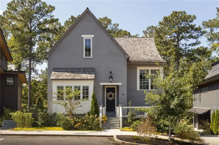 Gray brick exterior with a white trim accent
