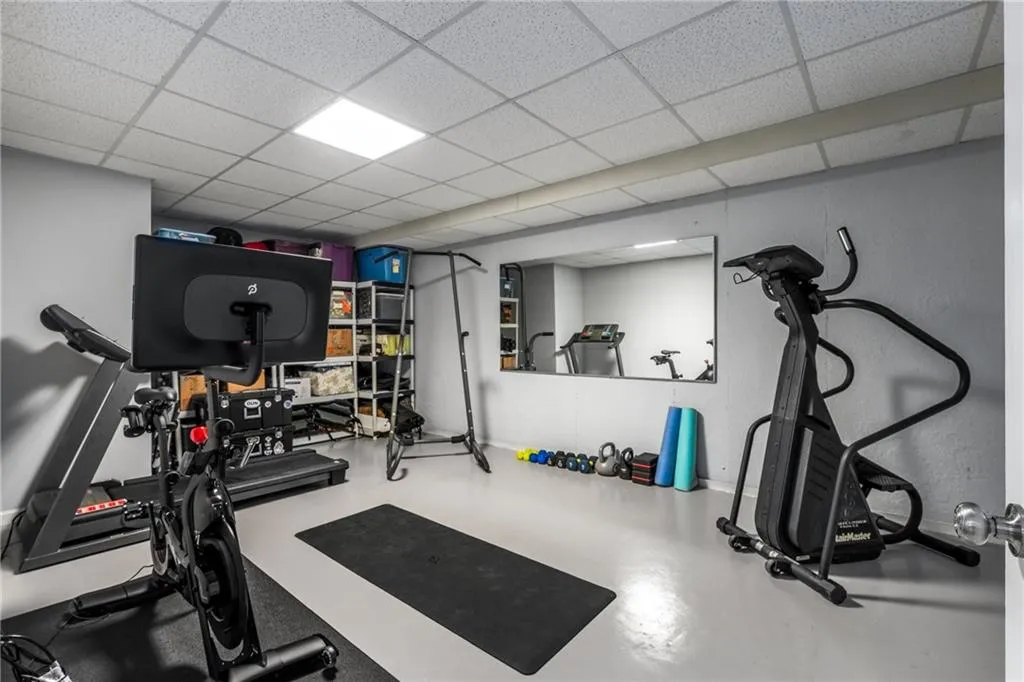 Exercise area with a paneled ceiling