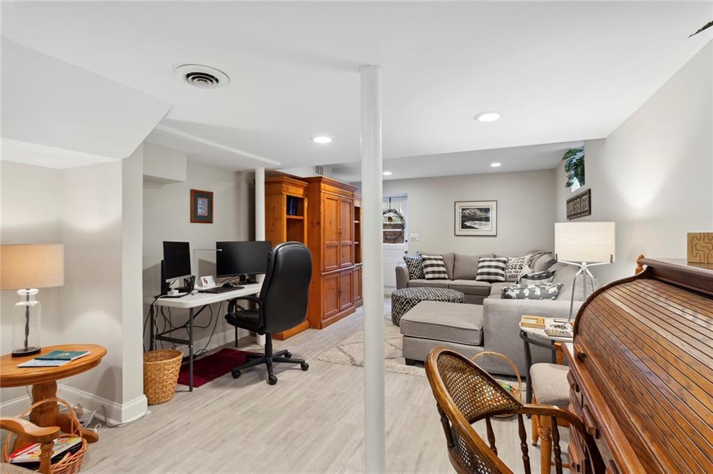 Home office featuring light hardwood / wood-style flooring Home office featuring light hardwood / wood-style flooring