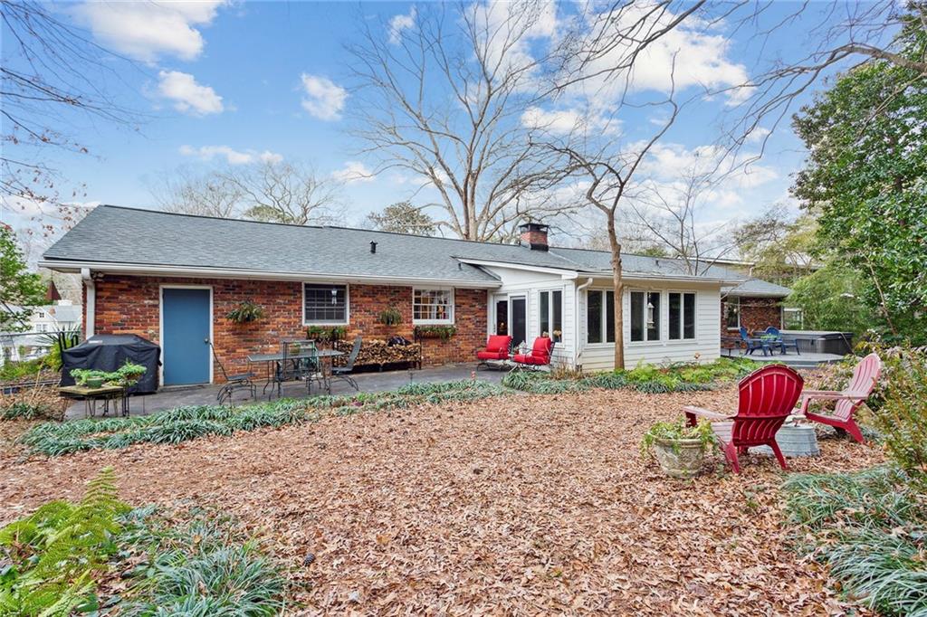 Rear view of house with a patio area Rear view of house with a patio area