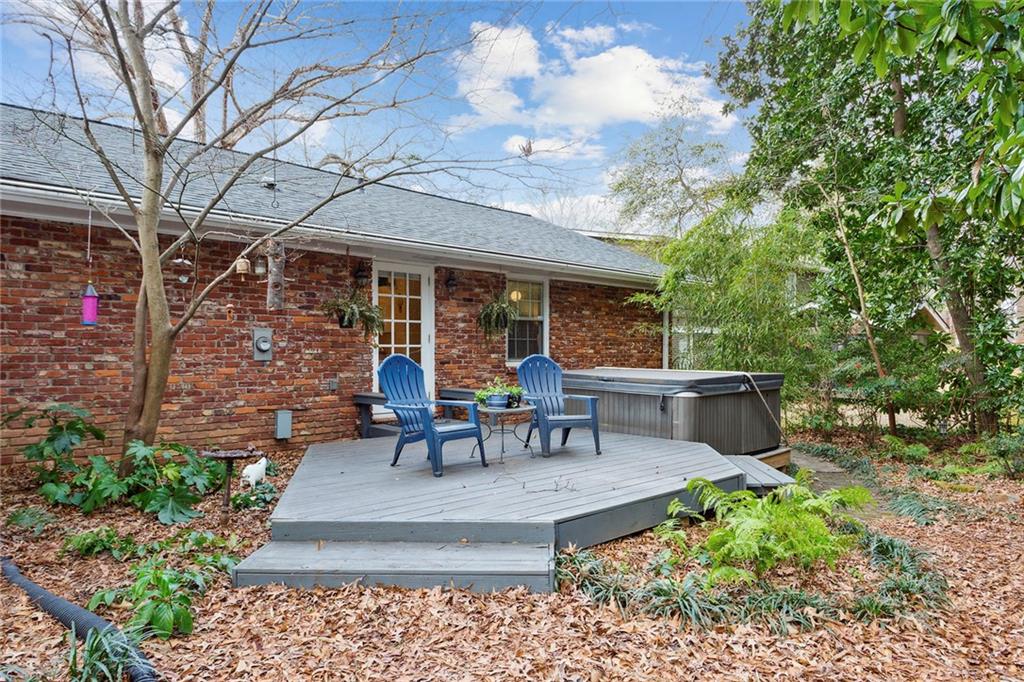 Wooden terrace featuring a hot tub Wooden terrace featuring a hot tub