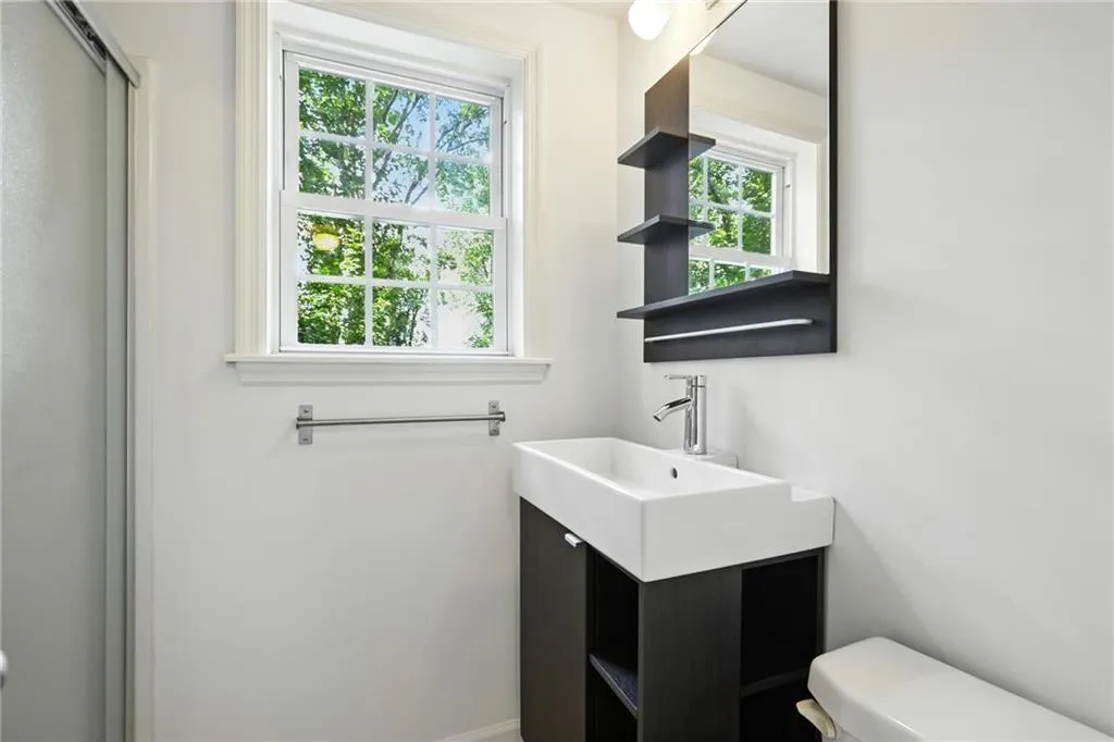 Bathroom with plenty of natural light and vanity