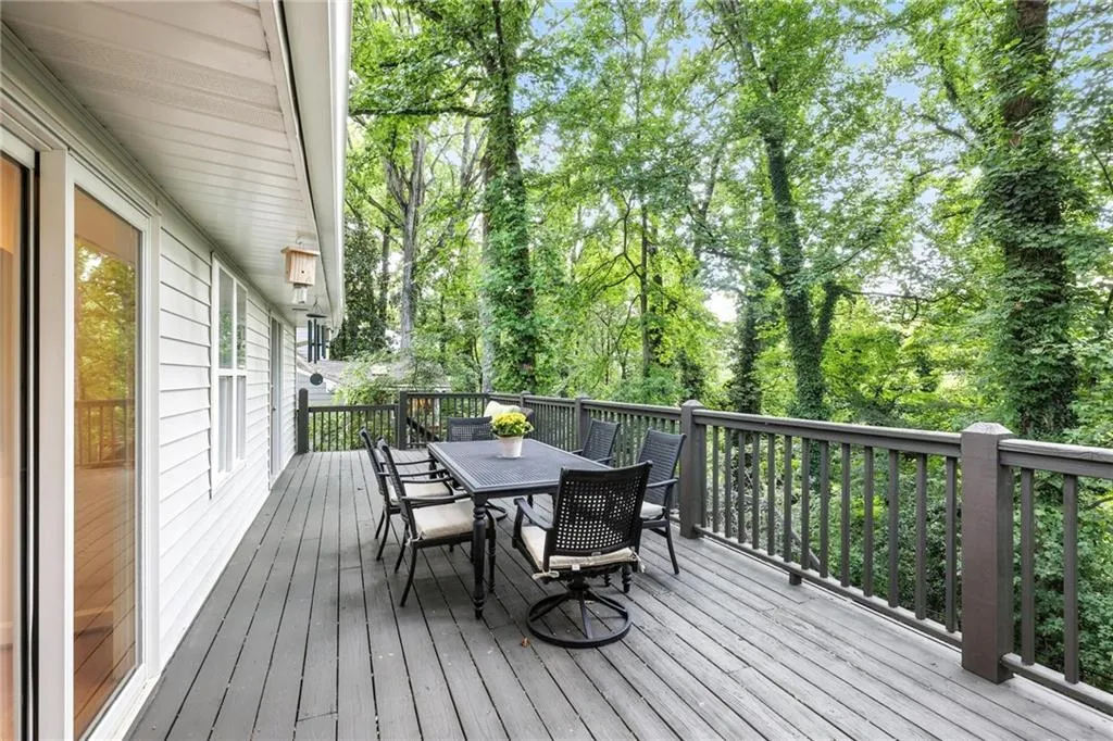 Wooden deck featuring outdoor dining space