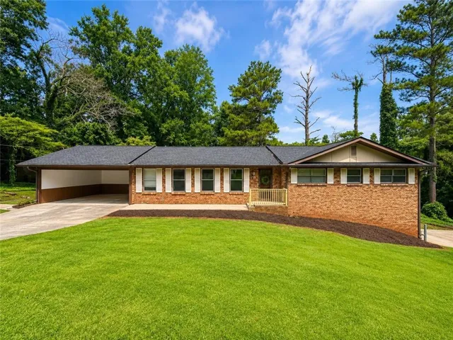 Brick exterior with white shutters