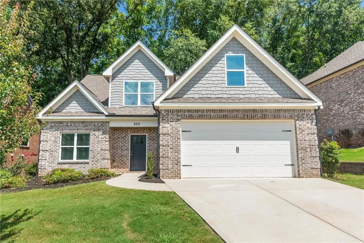 Brick and shake exterior with gabled roof lines