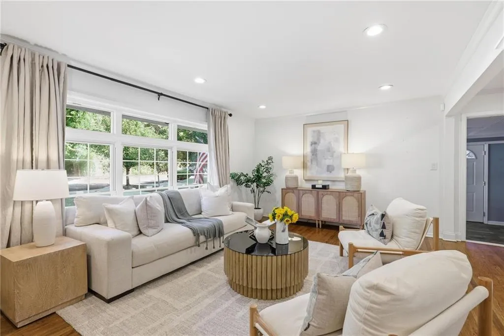 Living area featuring wood finished floors and recessed lighting