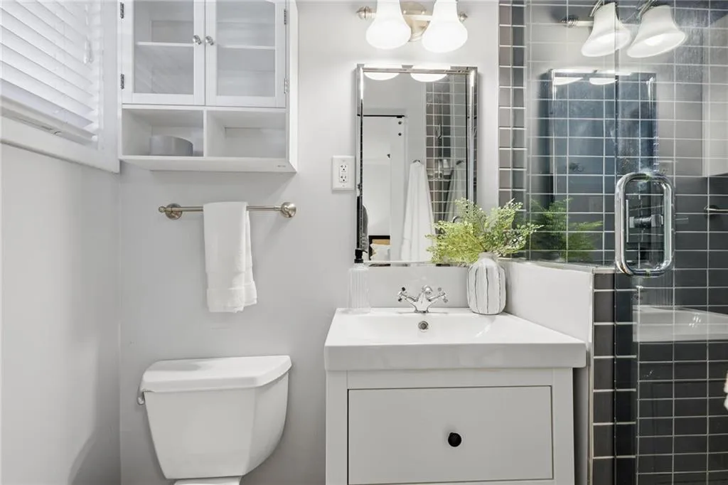Bathroom with a stall shower and vanity