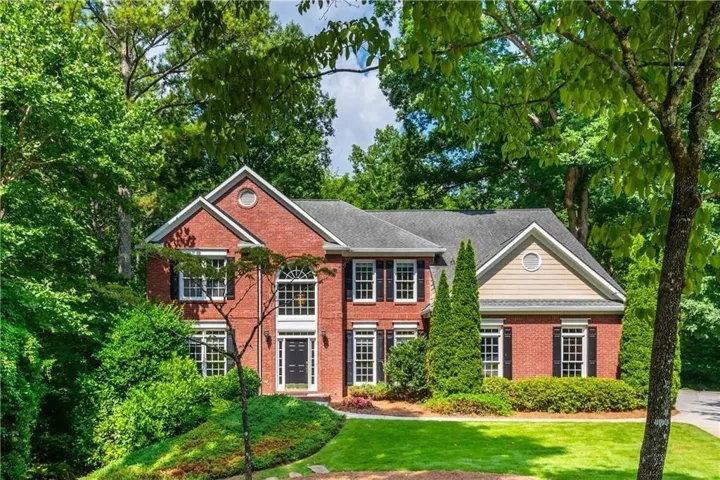 Beautiful mature landscaping envelopes this beautiful property. The front on its quiet cul-de-sac is lovely but just wait till you see the back!