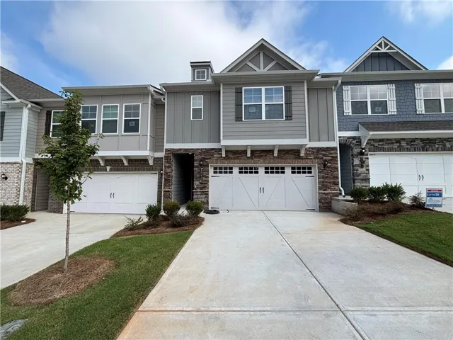 Stone facade, shake siding, and board-and-batten accents