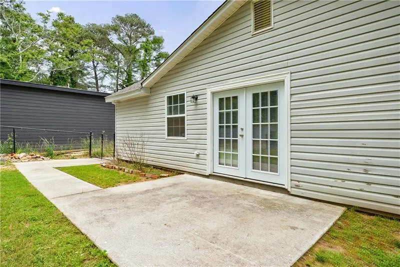 View of patio with fence