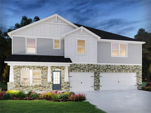 Two-story residence featuring a mixed-material facade with stone veneer and horizontal siding