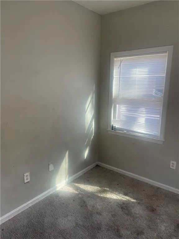 Empty room featuring carpet floors