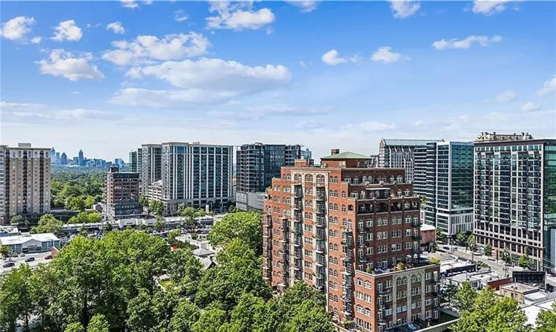 Expansive urban landscape featuring dense tree canopies and a diverse architectural skyline