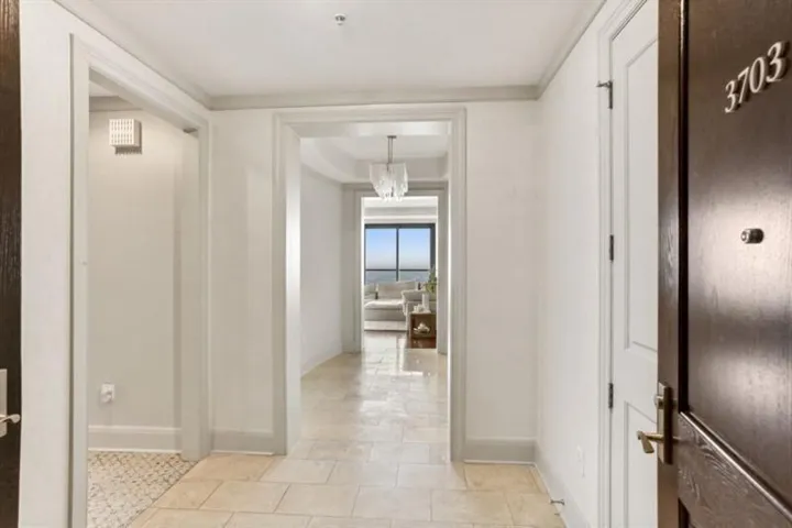 Double door foyer with marble floors