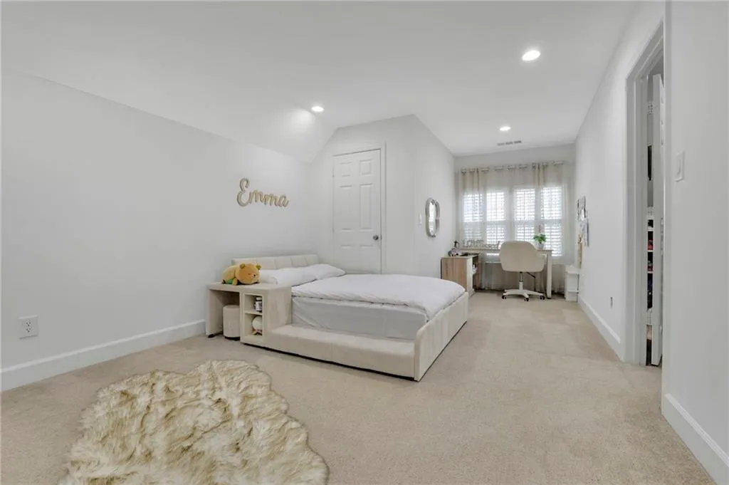 Bedroom with light carpet, recessed lighting, a desk, and lofted ceiling