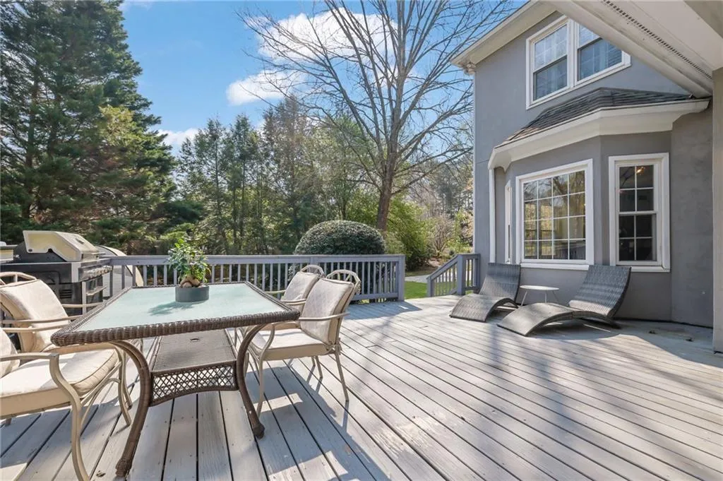 Deck with area for grilling and outdoor dining area
