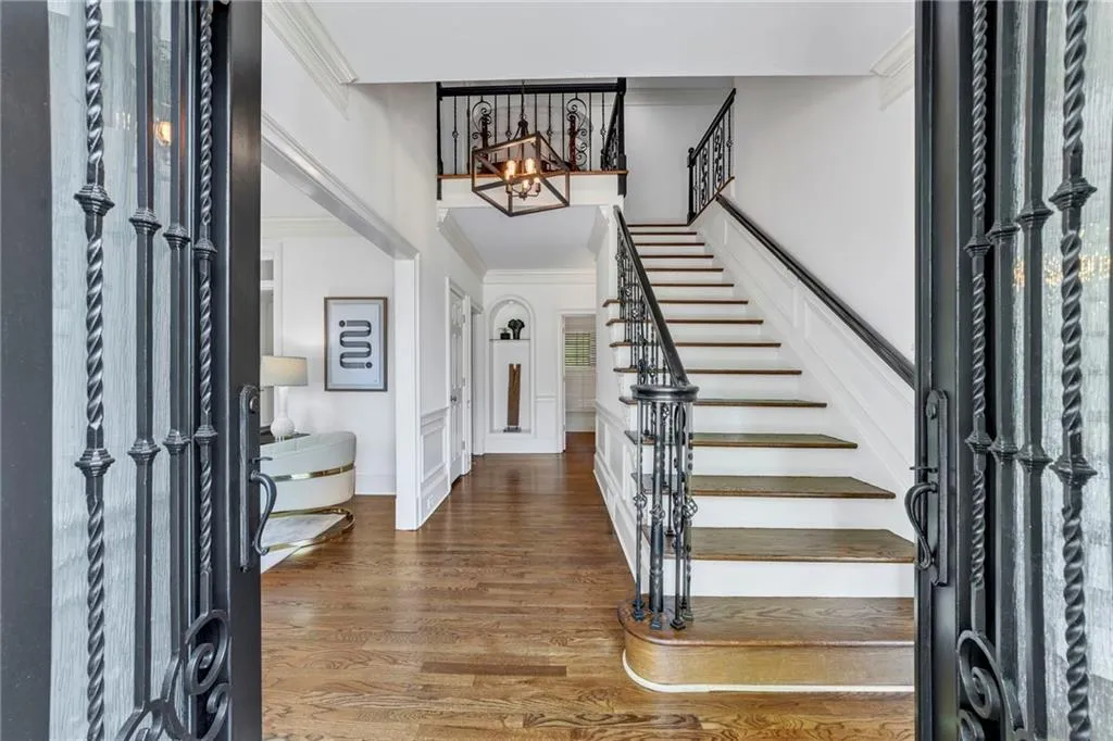 Entryway featuring dark hardwood / wood-style flooring and crown molding Entryway featuring dark hardwood / wood-style flooring and crown molding