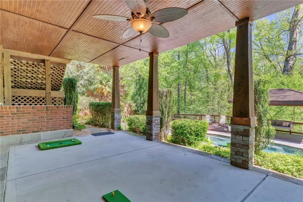 View of terrace featuring a fenced in pool and ceiling fans View of terrace featuring a fenced in pool and ceiling fans