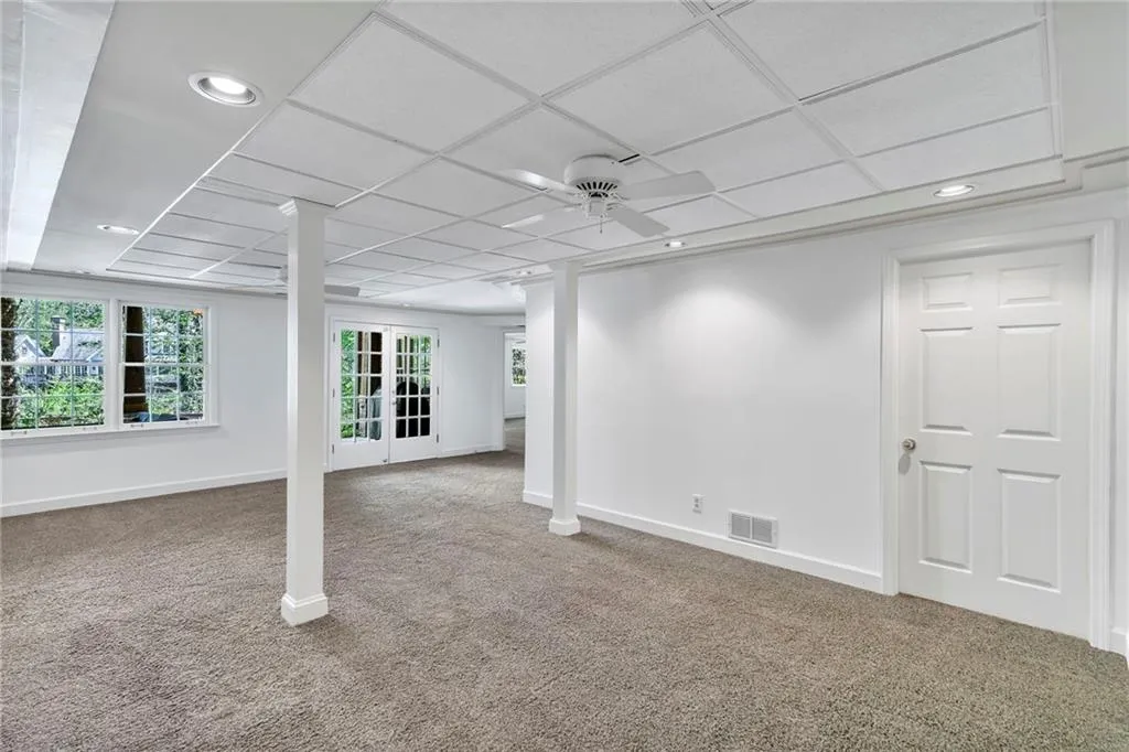 Spare room with a drop ceiling opens to pool area Spare room with a drop ceiling opens to pool area