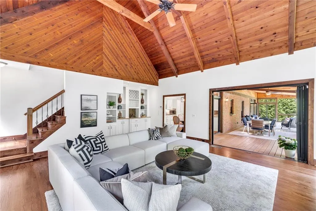 Unfurnished living room with wood ceiling, dark wood-type flooring, and high vaulted ceiling Unfurnished living room with wood ceiling, dark wood-type flooring, and high vaulted ceiling