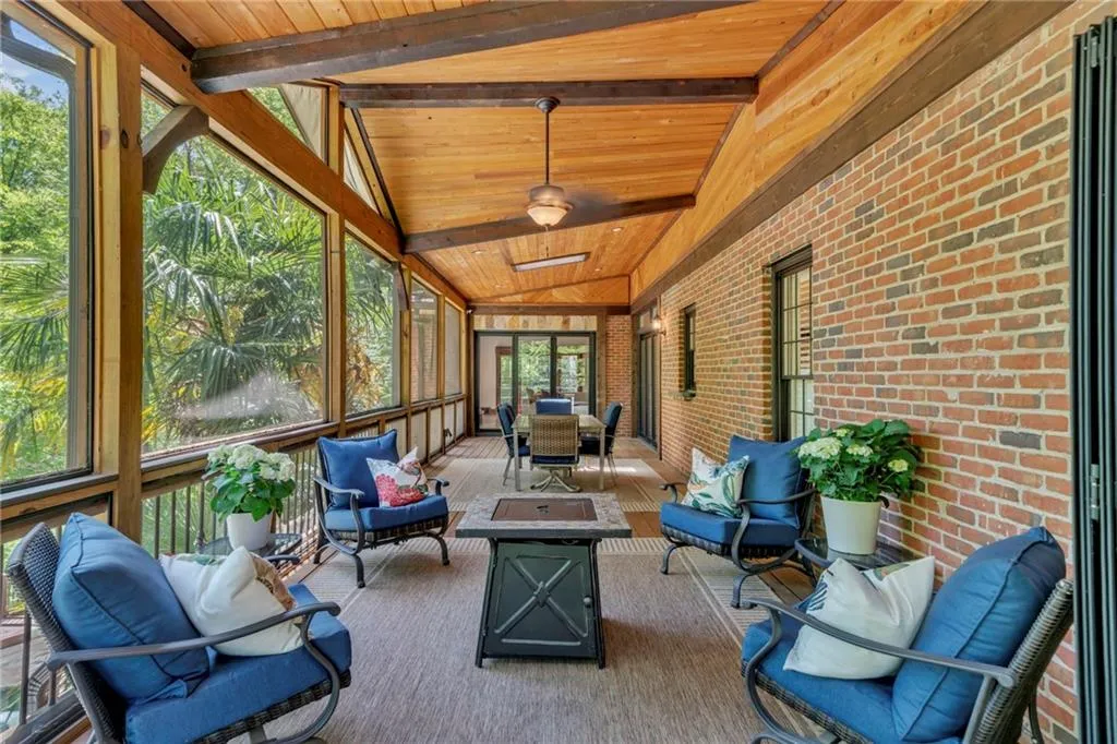 Sunroom featuring wood ceiling and vaulted ceiling with beams Sunroom featuring wood ceiling and vaulted ceiling with beams