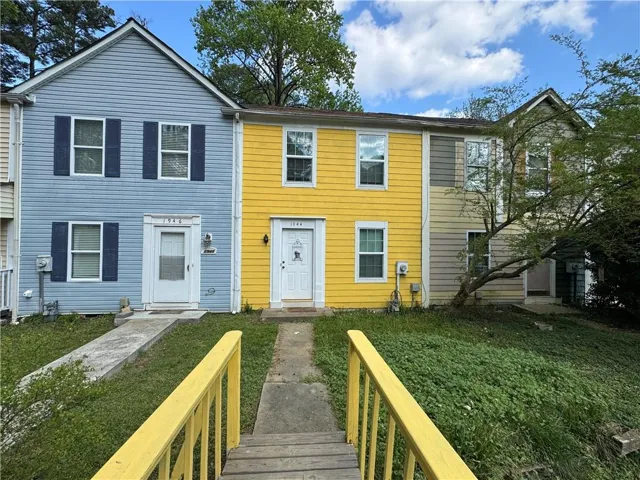Colonial-style house with a front yard