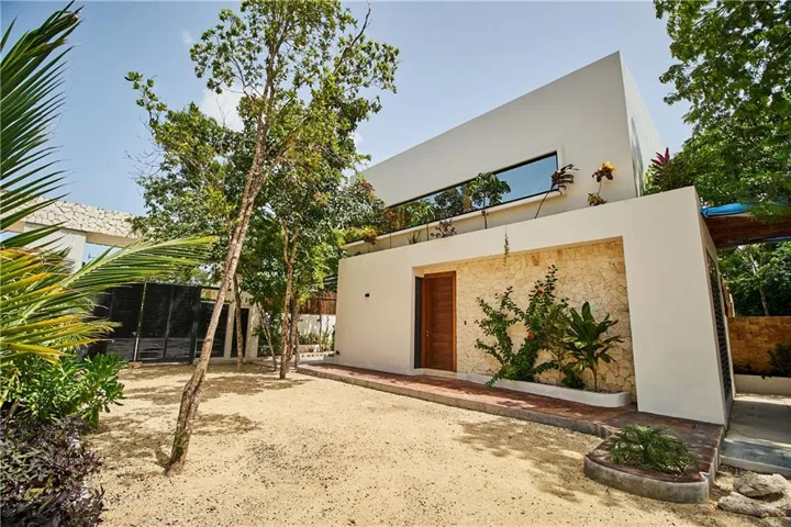 Back of property featuring stucco siding