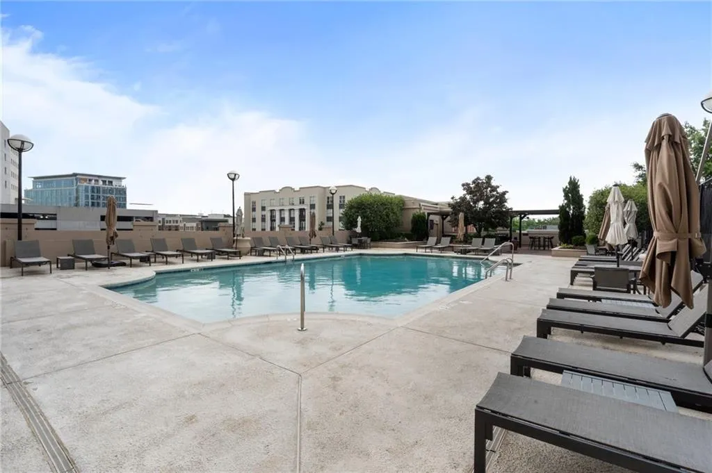 Community pool featuring a patio area