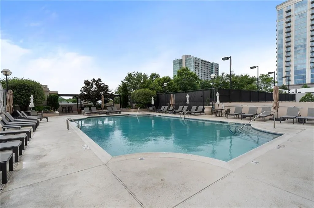 Community pool with a patio