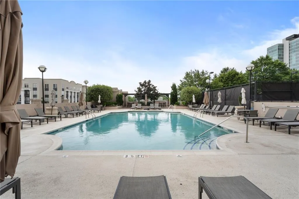Community pool with a patio area