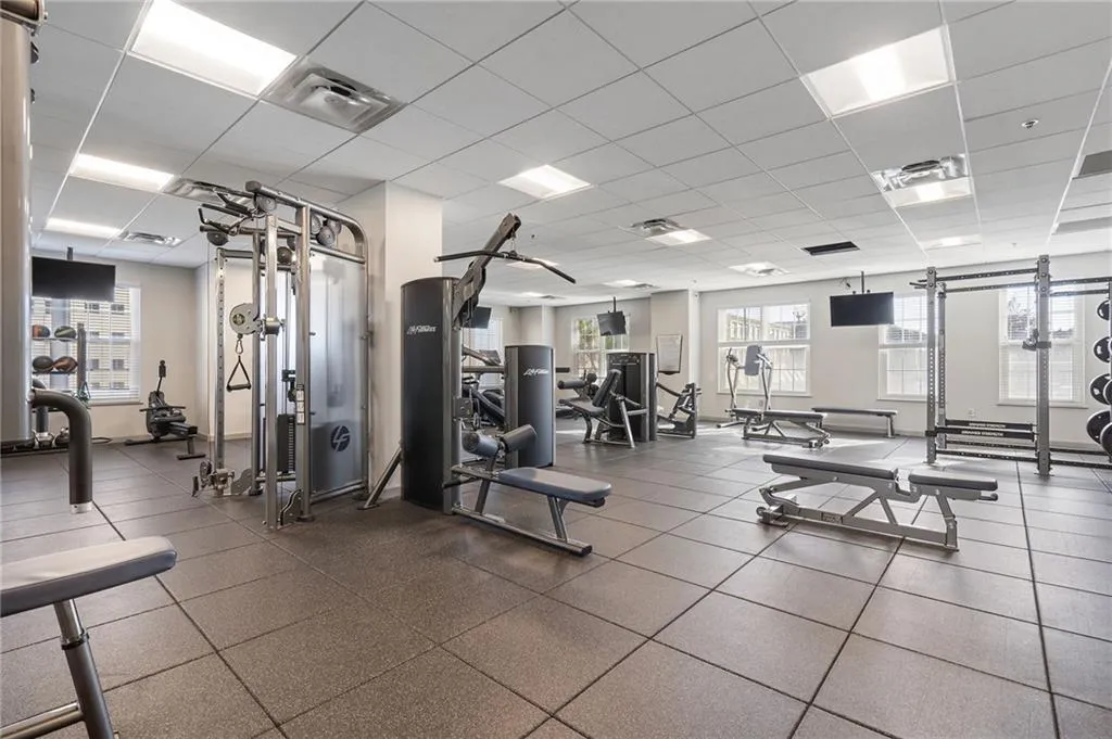 Workout area featuring a drop ceiling