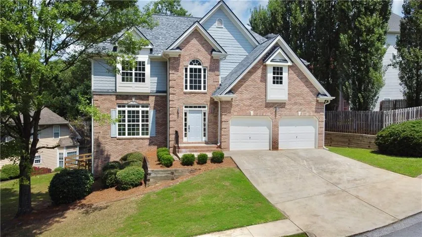 Brick and siding exterior with a gabled roof
