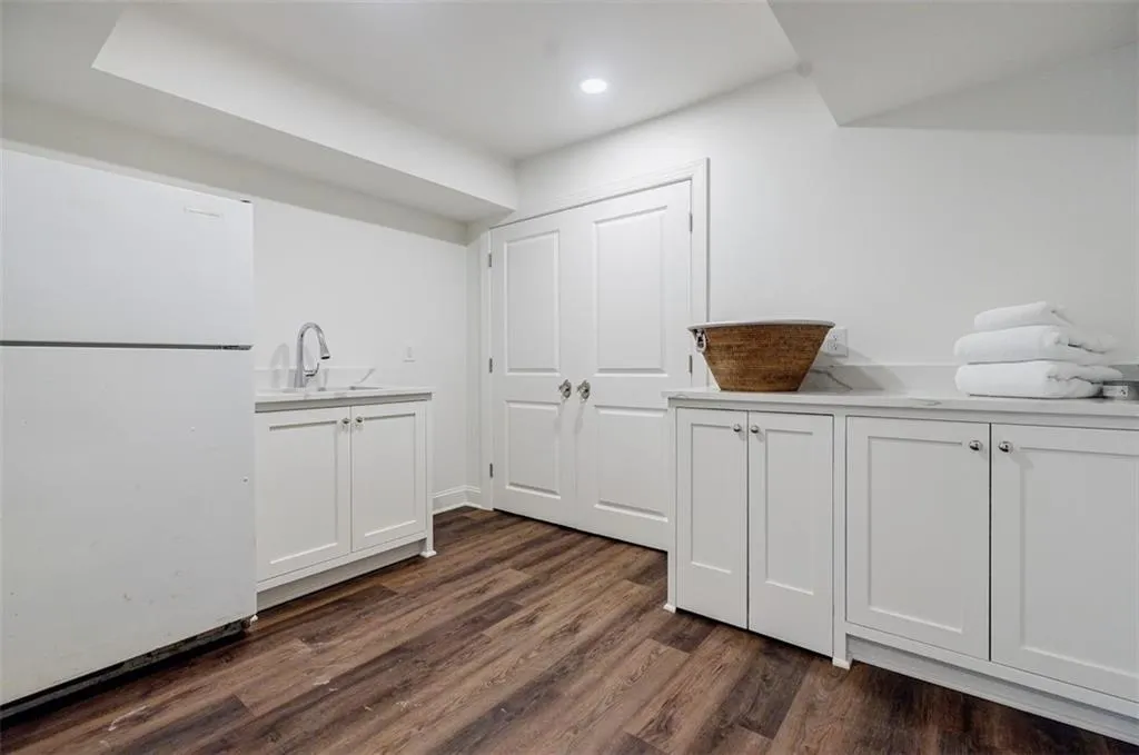 Laundry Room/sink/frig and large secondary pantry.
