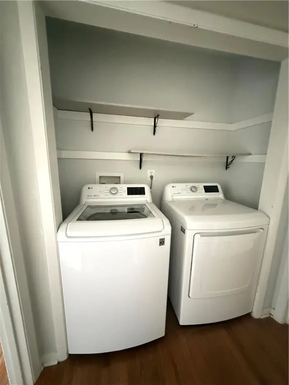 Dedicated laundry area featuring a white washing machine and dryer