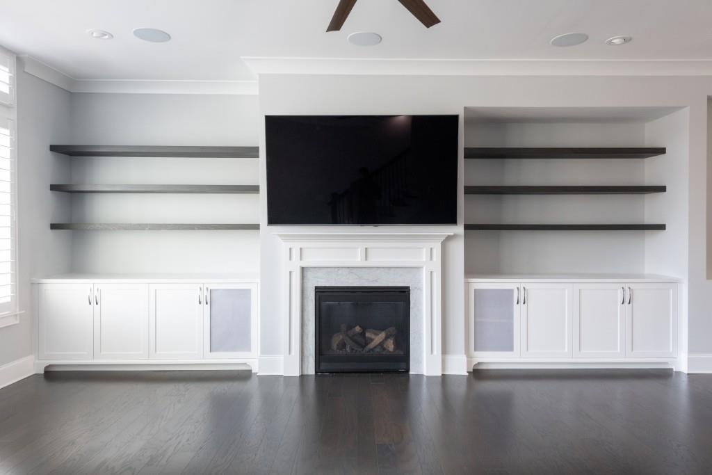 Custom built-in shelves and cabinets with high end speaker system