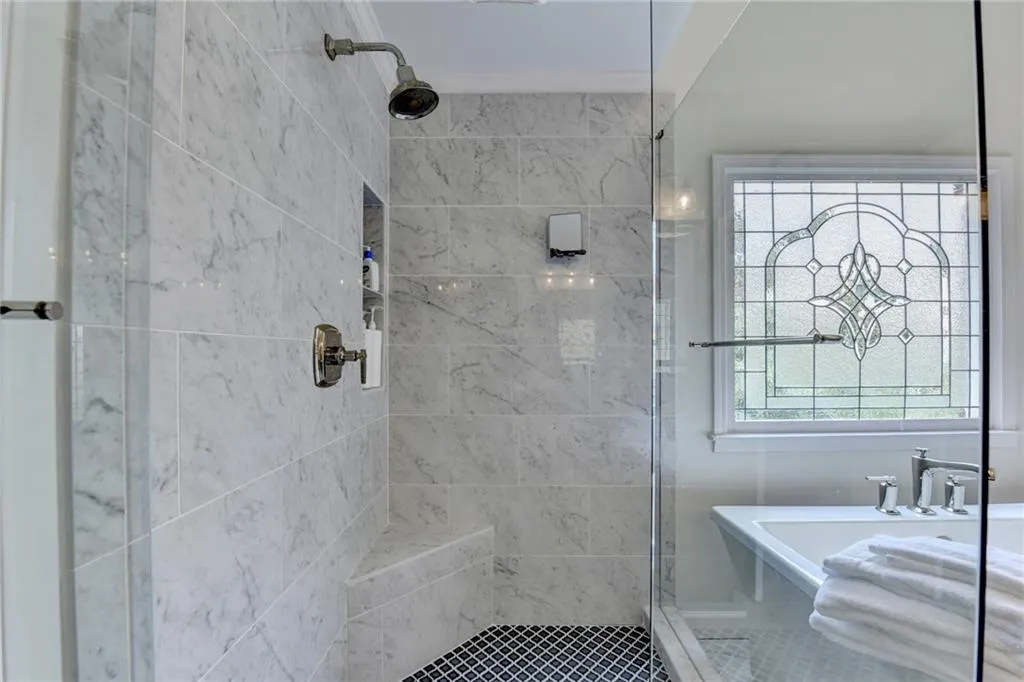 Bathroom featuring a shower stall