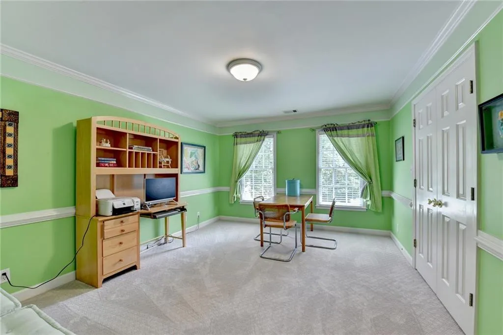 Office featuring ornamental molding and light colored carpet