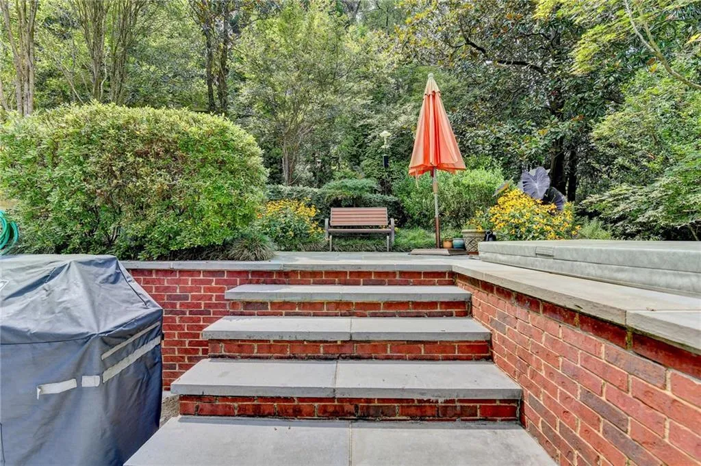 Wooden deck with grilling area and a patio area