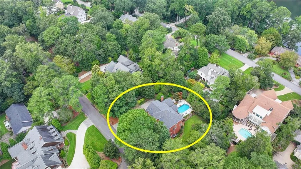 Aerial view of property's location with nearby suburban area