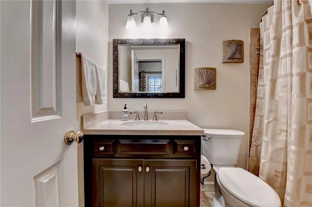 Bathroom featuring vanity and a shower with curtain