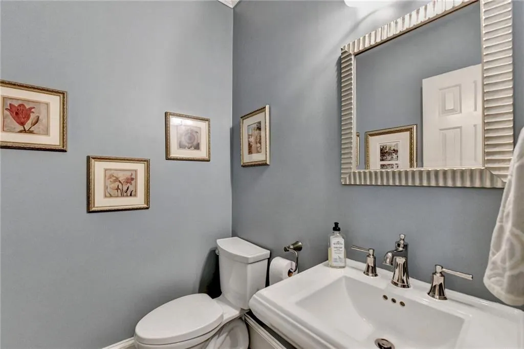 Half bathroom with toilet and a sink