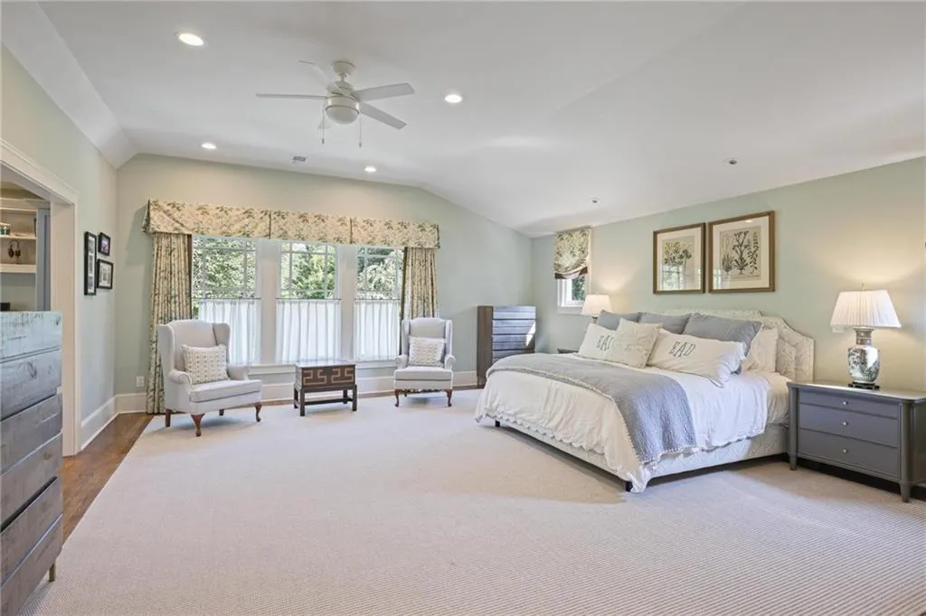 Bedroom with recessed lighting, vaulted ceiling, ceiling fan, and wood finished floors